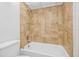 Bathroom features a fully tiled shower and tub combo at 11816 Raintree Lake Ln # B, Tampa, FL 33617