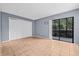 Bedroom features a sliding glass door to a screened lanai and ample closet space at 11816 Raintree Lake Ln # B, Tampa, FL 33617