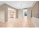 Kitchen and dining area with tile flooring and view to outdoors at 11816 Raintree Lake Ln # B, Tampa, FL 33617