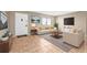 Staged living room with tile flooring, sofa, loveseat, rug and accent tables at 11816 Raintree Lake Ln # B, Tampa, FL 33617