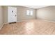 Bright living room with tile flooring and a white door at 11816 Raintree Lake Ln # B, Tampa, FL 33617