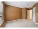 Carpeted bedroom featuring warm paint, window, and closet at 11839 Castine St, New Port Richey, FL 34654