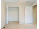 Bedroom includes closet with wire shelving and carpet flooring at 11839 Castine St, New Port Richey, FL 34654