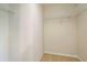 Walk-in closet with carpet flooring and wire shelving for optimal storage at 11839 Castine St, New Port Richey, FL 34654