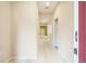 Neutral hallway leading to other rooms, featuring tiled floors and light walls at 11839 Castine St, New Port Richey, FL 34654