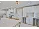 A modern kitchen featuring stainless steel appliances, lots of cabinets, and beverage coolers at 12468 Empire Dr, Seminole, FL 33772