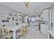 Spacious kitchen featuring a large island with bar seating, stainless steel appliances, and great lighting at 12468 Empire Dr, Seminole, FL 33772