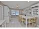 Updated kitchen with large center island and breakfast bar, stainless appliances, and modern decor at 12468 Empire Dr, Seminole, FL 33772
