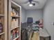 Laundry room including shelving, storage and modern washer and dryer at 12468 Empire Dr, Seminole, FL 33772