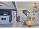 Open-concept living space featuring a dining room, fireplace and tv, and views to the kitchen and staircase at 12468 Empire Dr, Seminole, FL 33772