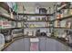Walk-in pantry with ample shelving and storage space for food and appliances at 12468 Empire Dr, Seminole, FL 33772
