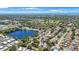 High aerial view showcasing a dense residential area surrounding a lake, offering a vibrant community setting at 12803 126Th Ter, Largo, FL 33774