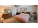 Bedroom with a dresser, workstation, and a comfortable bed at 12803 126Th Ter, Largo, FL 33774