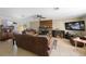 Comfortable living room featuring a brick fireplace and plenty of seating space at 12803 126Th Ter, Largo, FL 33774