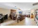 Comfortable living room featuring tiled floor, a fireplace, and cozy seating arrangements, perfect for relaxation at 12803 126Th Ter, Largo, FL 33774