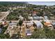 Aerial shot showcasing a neighborhood with lush trees, near the coast at 1412 Coburn Dr, Tarpon Springs, FL 34689