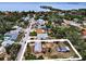Aerial view of property, neighborhood, water views, and lush surrounding trees, perfect location at 1412 Coburn Dr, Tarpon Springs, FL 34689