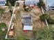 Aerial view shows the property's buildings, large fenced yard at 1412 Coburn Dr, Tarpon Springs, FL 34689