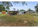 Wide backyard with sheds and storage, offering great potential at 1412 Coburn Dr, Tarpon Springs, FL 34689