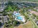 Aerial view of community pools, landscaping and recreational areas, a neighborhood centerpiece at 14223 Lambert Bridge Ln, Lithia, FL 33547