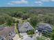 An aerial of a lovely home surrounded by trees in a desirable neighborhood at 14223 Lambert Bridge Ln, Lithia, FL 33547
