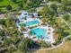 Aerial view of community pools, landscaping and recreational areas offer a resort-style experience at 14223 Lambert Bridge Ln, Lithia, FL 33547
