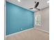 Comfortable bedroom featuring a modern fan, bright wall, window with bright natural light at 14223 Lambert Bridge Ln, Lithia, FL 33547