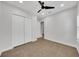 Bedroom featuring hard floors, closet, neutral walls, and natural light at 14223 Lambert Bridge Ln, Lithia, FL 33547