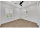 Bedroom featuring hard floors, closet, shutters, neutral walls, and natural light at 14223 Lambert Bridge Ln, Lithia, FL 33547