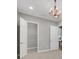Bright bedroom featuring a unique decorative lighting fixture and spacious layout, perfect for relaxation at 14223 Lambert Bridge Ln, Lithia, FL 33547