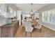 Dining room features a round table with seating for six, and a sideboard at 14223 Lambert Bridge Ln, Lithia, FL 33547