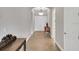 Inviting foyer with wood-look tile and elegant decor, leading to various rooms at 14223 Lambert Bridge Ln, Lithia, FL 33547