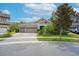 Attractive single-story home with a three-car garage and neatly manicured landscaping at 14223 Lambert Bridge Ln, Lithia, FL 33547