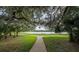 Scenic walkway through lush landscaped grounds, offering a peaceful retreat at 14223 Lambert Bridge Ln, Lithia, FL 33547