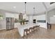 A modern kitchen with stainless steel appliances, a large island, and ample cabinetry at 14223 Lambert Bridge Ln, Lithia, FL 33547