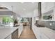 Bright kitchen featuring white cabinetry, stainless steel appliances, and an eat-in dining area at 14223 Lambert Bridge Ln, Lithia, FL 33547