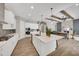 The well-appointed kitchen features a large island, modern appliances, and an open layout at 14223 Lambert Bridge Ln, Lithia, FL 33547