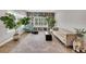 Bright living room features a built-in bookcase, a comfortable couch, and ample lighting at 14223 Lambert Bridge Ln, Lithia, FL 33547