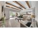 Open-concept living room with sliding glass doors leading to outdoor seating area at 14223 Lambert Bridge Ln, Lithia, FL 33547