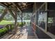 Community center porch with access to a lake and a cozy spot to enjoy the outdoors at 14223 Lambert Bridge Ln, Lithia, FL 33547