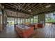 A community recreation room features tables, seating, and scenic views of the lake through screened windows at 14223 Lambert Bridge Ln, Lithia, FL 33547