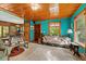 Spacious living room showcasing an open floor plan and hardwood ceiling at 15012 N 301 Hwy, Thonotosassa, FL 33592