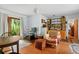 Inviting living room with vintage décor, shelving, and natural light at 15012 N 301 Hwy, Thonotosassa, FL 33592