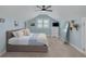 Stylish bedroom with a sloped ceiling, a comfortable bed, and ample natural light at 152 Glenn Moor Cir, Dunedin, FL 34698