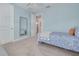 Inviting bedroom with blue walls, a comfortable bed, and an ensuite bathroom at 152 Glenn Moor Cir, Dunedin, FL 34698
