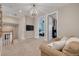 Cozy loft area with plush carpeting, a comfortable sofa, and views into a secondary bedroom at 152 Glenn Moor Cir, Dunedin, FL 34698