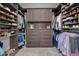 Spacious walk-in closet features custom shelving, drawers, and ample storage space at 152 Glenn Moor Cir, Dunedin, FL 34698