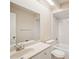 Clean bathroom features vanity, toilet, and a shower-tub combo at 15202 Morning Dr, Lutz, FL 33559
