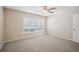 Cozy bedroom with carpet and large window at 15202 Morning Dr, Lutz, FL 33559