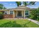 Inviting home entrance with well-maintained lawn and neutral exterior, providing a warm welcome at 15202 Morning Dr, Lutz, FL 33559